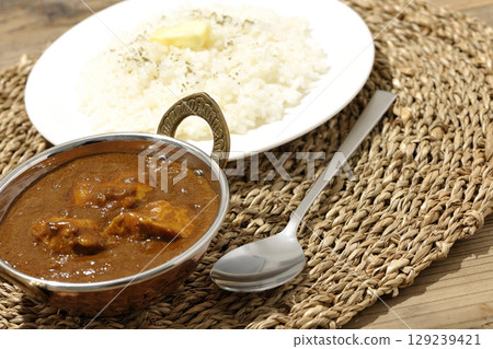Chicken masala curry and butter rice Chicken masala curry and butter rice 129239421