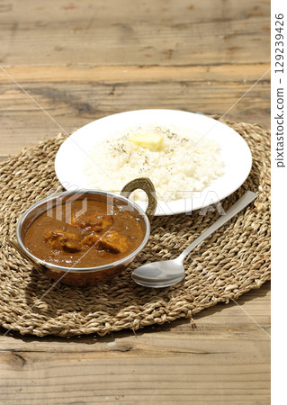 Chicken masala curry and butter rice 129239426