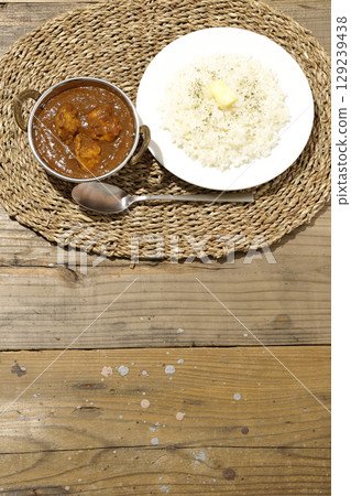 Chicken masala curry and butter rice 129239438