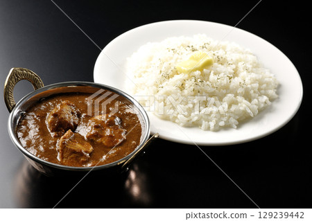 Chicken masala curry and butter rice Chicken masala curry and butter rice 129239442