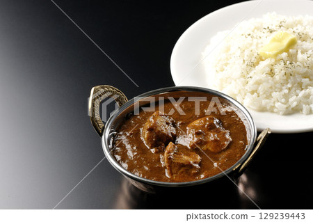 Chicken masala curry and butter rice Chicken masala curry and butter rice 129239443