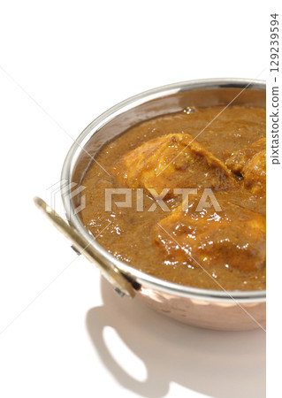Chicken masala curry photographed on a white background 129239594