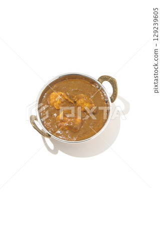 Chicken masala curry photographed on a white background 129239605