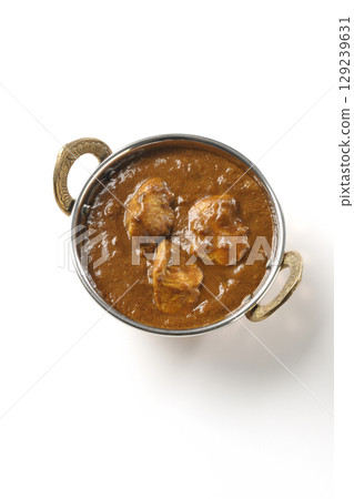 Chicken masala curry photographed on a white background 129239631
