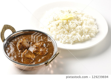Chicken masala curry and butter rice Chicken masala curry and butter rice 129239694