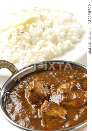 Chicken masala curry and butter rice 129239700