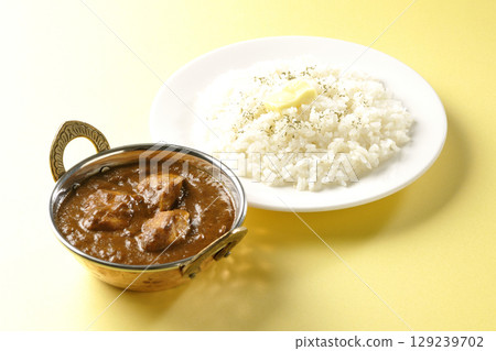 Chicken masala curry and butter rice 129239702
