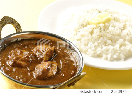 Chicken masala curry and butter rice Chicken masala curry and butter rice 129239703