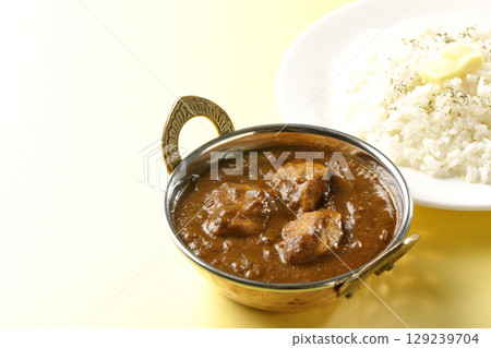 Chicken masala curry and butter rice Chicken masala curry and butter rice 129239704
