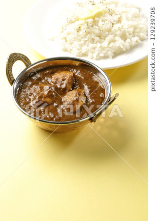 Chicken masala curry and butter rice Chicken masala curry and butter rice 129239708