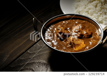 Chicken masala curry and butter rice Chicken masala curry and butter rice 129239714