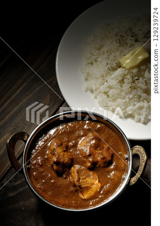 Chicken masala curry and butter rice Chicken masala curry and butter rice 129239724