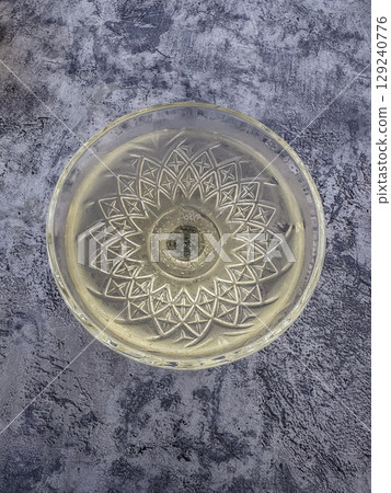 Elegant bubbly drink in etched glass, luxury celebration mood. High quality photo Elegant bubbly drink in etched glass, luxury celebration mood. High quality photo 129240776