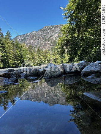 A mountain reflected on the surface of the water 129241693
