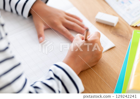 Elementary school boy doing homework at home 129242241