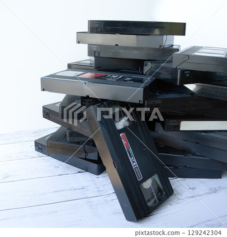 Piles of videotapes Piles of videotapes 129242304