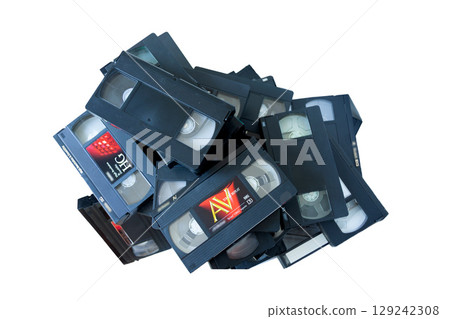A pile of VHS video tapes on a white background A pile of VHS video tapes on a white background 129242308