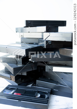 Piles of videotapes 129242313
