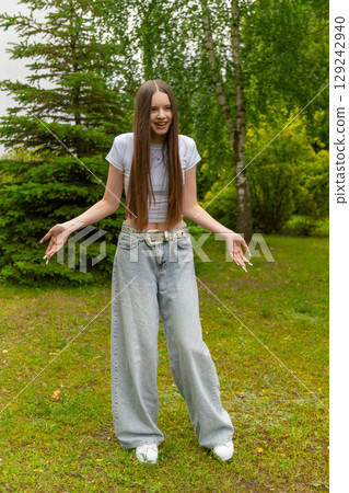 A beautiful young girl with long dark blonde hair A beautiful young girl with long dark blonde hair 129242940