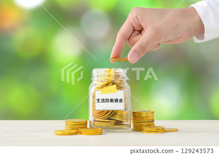 The hands of someone saving for a life insurance fund The hands of someone saving for a life insurance fund 129243573