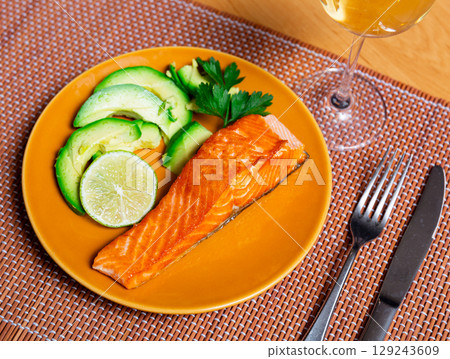 Salmon served with avocado and herbs Salmon served with avocado and herbs 129243609