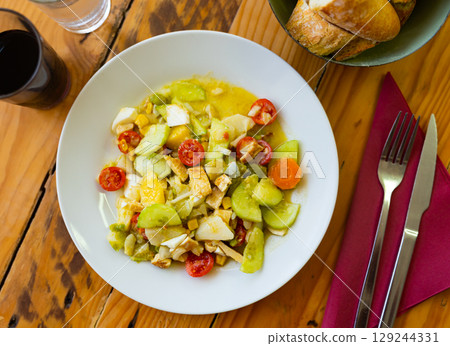 Vitamin summer salad of fresh vegetables, cucumber, tomato, dried crust and chicken meat fillet 129244331