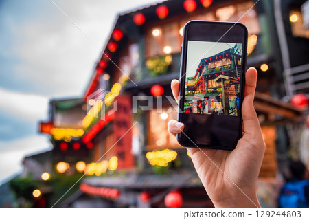Jiufen Old Street is a narrow, winding alleyway with shops, teahouses, and restaurants that offers tourists a view of traditional Taiwanese life. 129244803