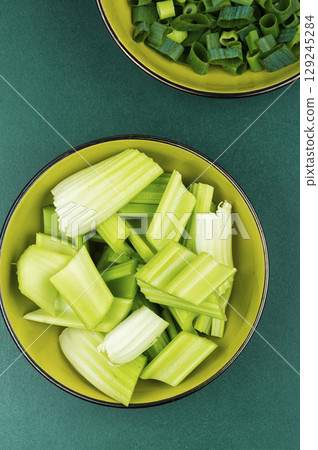 Celery stalks, green stalks, freshly harvested. 129245284
