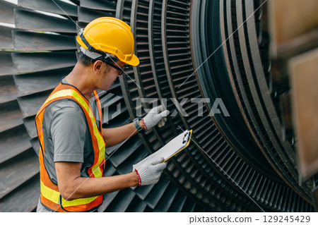 Professional Asian engineer male working service power plant turbine fan blade electrical generator 129245429