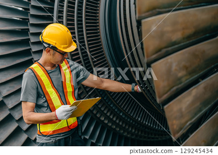 Professional Asian engineer male working service power plant turbine fan blade electrical generator 129245434