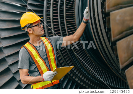 Professional Asian engineer male working service power plant turbine fan blade electrical generator 129245435