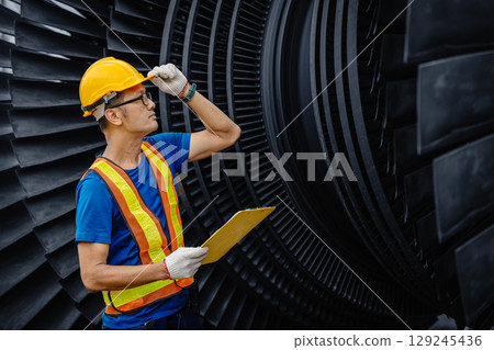 Professional Asian engineer male working service power plant turbine fan blade electrical generator 129245436