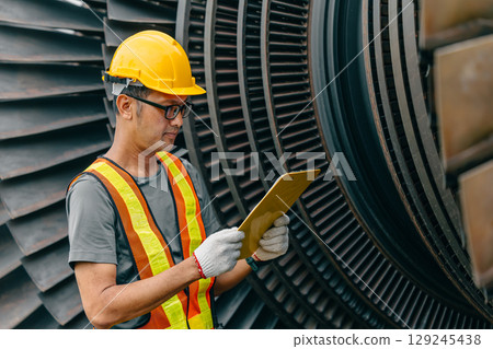 Professional Asian engineer male working service power plant turbine fan blade electrical generator 129245438