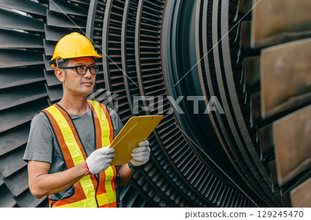 Professional Asian engineer male working service power plant turbine fan blade electrical generator 129245470