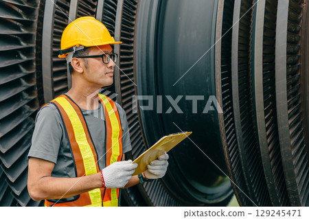 Professional Asian engineer male working service power plant turbine fan blade electrical generator 129245471