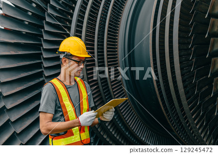 Professional Asian engineer male working service power plant turbine fan blade electrical generator 129245472