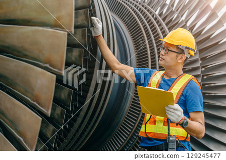 Professional Asian engineer male working service power plant turbine fan blade electrical generator Professional Asian engineer male working service power plant turbine fan blade electrical generator 129245477