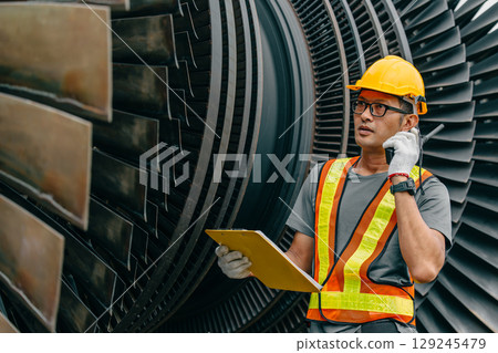Professional Asian engineer male working service power plant turbine fan blade electrical generator 129245479
