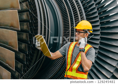 Professional Asian engineer male working service power plant turbine fan blade electrical generator 129245481