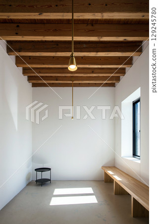 Modern Minimalist Interior With Wooden Beams and Natural Light in a Serene Space 129245780