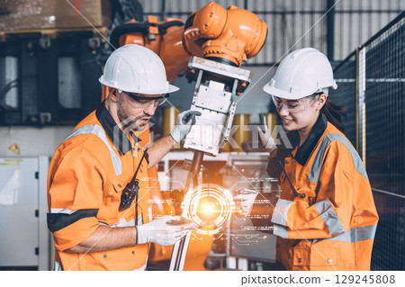 Engineer workers team with modern robotic technology digital innovation device in hand concept 129245808