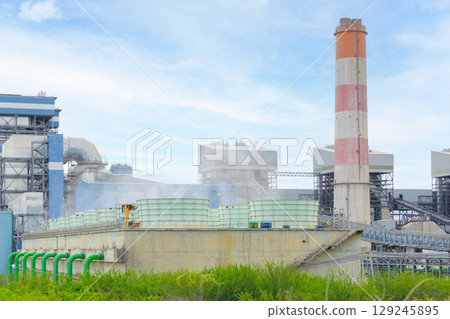 Green Coal power plant, Modern Power clean energy generation building with chimney in Thailand Green Coal power plant, Modern Power clean energy generation building with chimney in Thailand 129245895