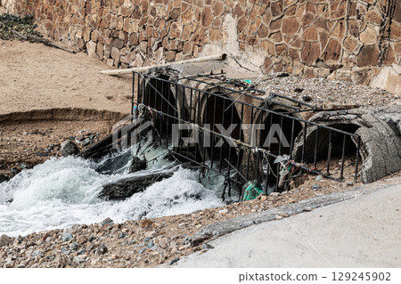 Industry draining sewage pipe, Water pollution rivers and ecology impact. sewer drain pipe, bad water from city. Wastewater management. 129245902