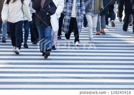 Crowd of People cross the road zebra crossing walking metro Japan city metro rush hours Crowd of People cross the road zebra crossing walking metro Japan city metro rush hours 129245918