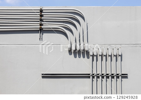 Professional outdoor electrical wiring corner installation in metal conduit connector box. Professional outdoor electrical wiring corner installation in metal conduit connector box. 129245928