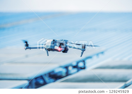 Engineer drone, UAV solar roof inspector, flying drone use inspect panel industry building concept Engineer drone, UAV solar roof inspector, flying drone use inspect panel industry building concept 129245929