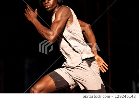 Athletic man sprinting during a fitness workout in dynamic motion Athletic man sprinting during a fitness workout in dynamic motion 129246148