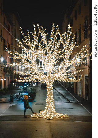 Child Enjoys Christmas Street Illumination Display 129246396