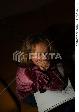 Thoughtful Child Holding Pencil in Creative Moment Thoughtful Child Holding Pencil in Creative Moment 129246398