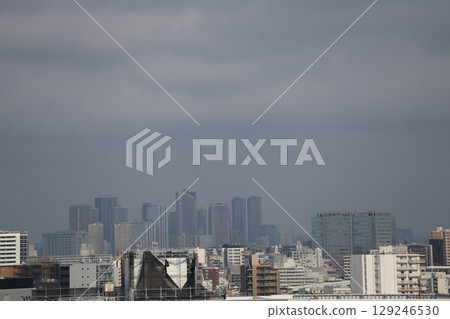 Urban cityscape scene with cloudy sky and skyscraper buildings Urban cityscape scene with cloudy sky and skyscraper buildings 129246530
